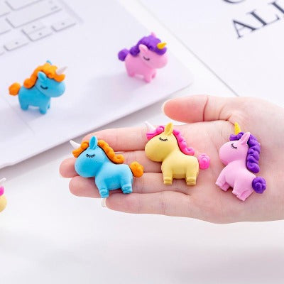 a handful of unicorn erasers